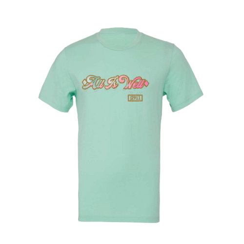 A mint green t-shirt with 'All is Well' text and a sparkleberry design on the front, displayed on a silver background.